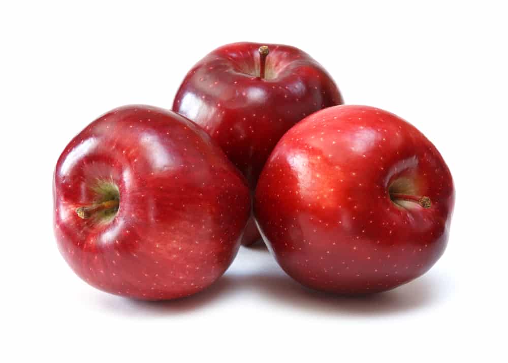three red apples on white background