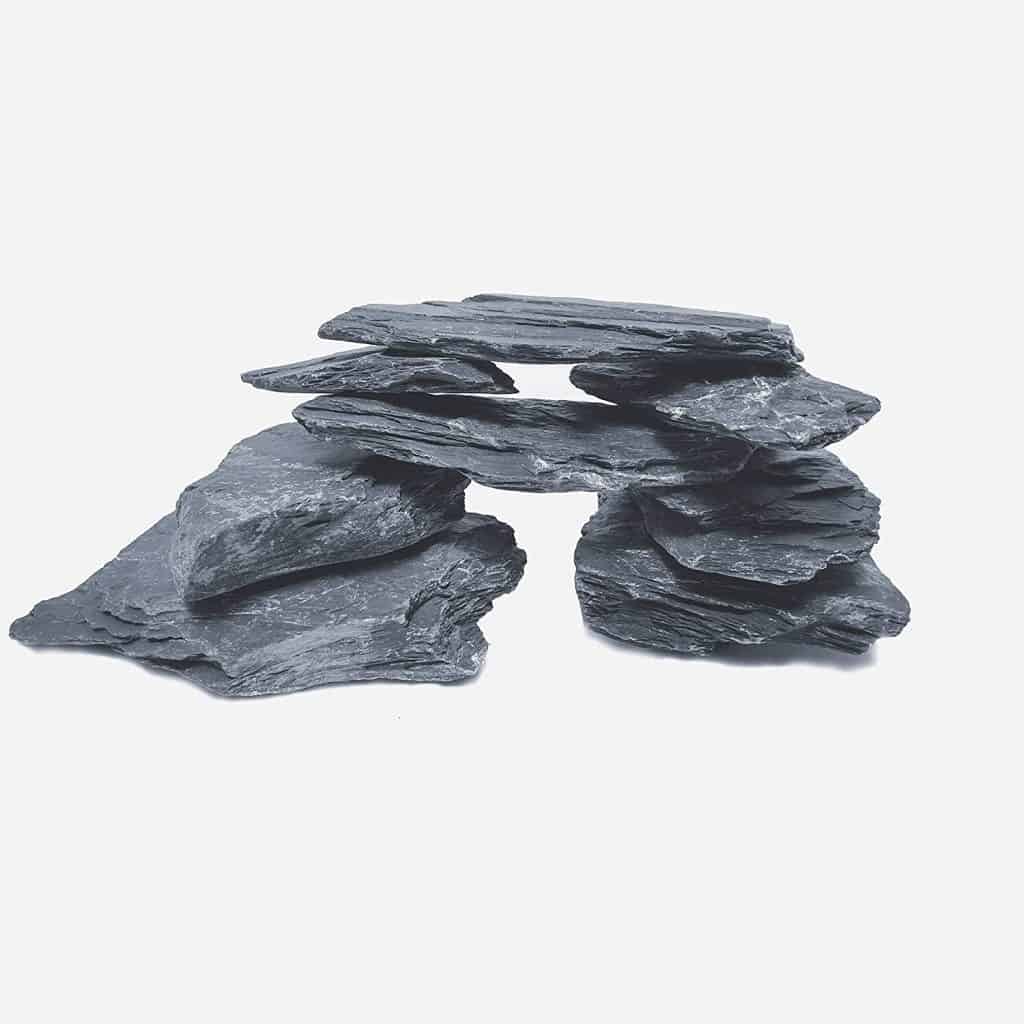A stack of slate rocks against a white background